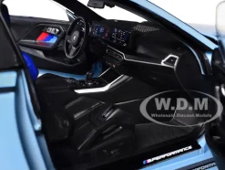 2024 BMW M2 Performance Parts Zandvoort Blue with Carbon Top and Black Stripes 1/18 Diecast Model Car by Solido