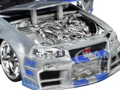Brian's Nissan Skyline GT-R (R34) RHD (Right Hand Drive) Silver Color Brush Finish with Blue Stripes "2 Fast 2 Furious" (2003) Movie "Fast & Furious" Series 1/24 Diecast Model Car by Jada