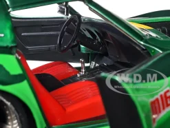 1969 Chevrolet Corvette Stingray ZL1 Green Metallic with Yellow Stripes and Cammy Diecast Figure Street Fighter Video Game Anime Hollywood Rides Series 1/24 Diecast Model Car Jada 30837