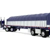 Peterbilt 352 COE 110" Sleeper and 53’ Wilson Roadbrute Flatbed Trailer with Covered Wagon White with Blue Stripes 1/64 Diecast Model by DCP/First Gear