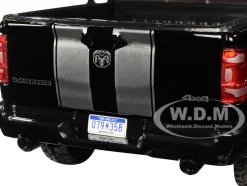 2019 RAM 1500 Laramie Crew Cab Pickup Truck Black Silver Stripes 1/24 Diecast Model Car Motormax 79357