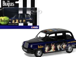 The Beatles London Taxi RHD (Right Hand Drive) "Lady Madonna" Black and Dark Blue with Graphics Diecast Model Car by Corgi